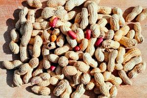 roast peanuts on wooden board under sun photo