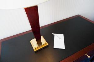 envelope on table with electric lamp photo
