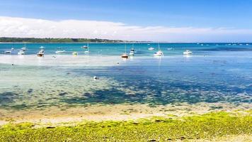 boats in bay Anse de Perros near Perros-Guire photo