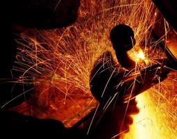 sparks during welding car bottom photo