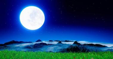 full moon night bright blue light On the high mountain complex. The mountain range has fog on the top of the mountain. Fresh green fields with flowers. Full moon night nature in the middle of the fore