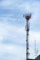 Telephone transmission pole on blue sky background photo