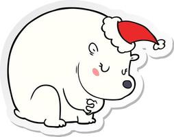 cute sticker cartoon of a polar bear wearing santa hat vector