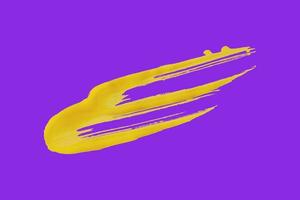 yellow brush isolated on purple background photo