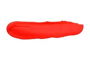 Red brush isolated on white background. Red watercolor photo