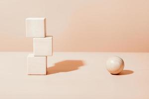 natural wooden cubes and ball, neutral beige geometric details scene for product presentation. mock up for sale or advertizing. photo