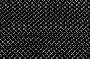 Steel mesh wire fence isolated on black background with clipping path photo