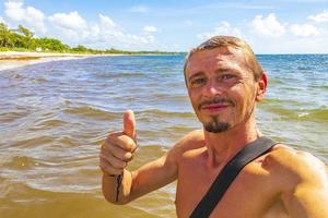 Male tourist traveler at tropical beach Playa del Carmen Mexico. photo