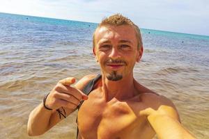 Male tourist traveler at tropical beach Playa del Carmen Mexico. photo