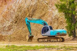 Excavator and removed mountain Koh Samui Thailand. photo