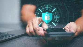 Businessmen use smartphones to connect data through authentication and privacy devices, online security protection technology, password authentication and cybersecurity photo