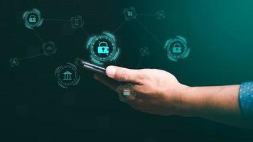 Businessmen use smartphones to connect data through authentication and privacy devices, online security protection technology, password authentication and cybersecurity photo