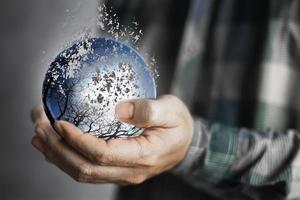 Earth day, Human hands holding blue earth, save earth concept. the deteriorating world. photo