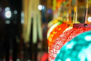 Closeup Colorful Chinese paper lantern hanging show for tourists at lantern festival. photo