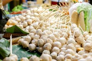 Steamed Pork balls line up on shelf for sale in the market. photo