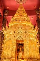 The enshrining of the Buddha name Phra Chao Lan Ton in Wat Phra That Lampang Luang, Lampang Thailand. It's the golden largest and most beautiful Buddha statue in the North of Thailand. photo