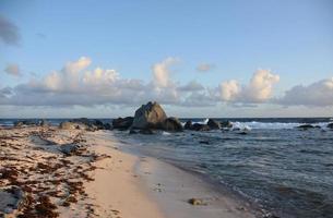 Rounded Rocks Jutting Out of the Ocean photo