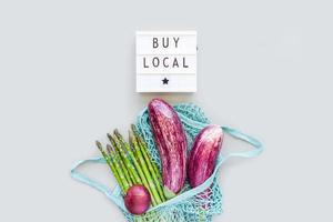 Fresh organic vegetables cotton mesh shopping bag photo