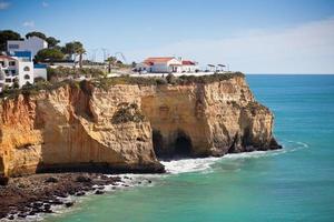 Seaside village on a cliff overlooking the ocean in Portugal photo