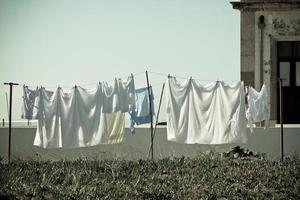 Washing hanging outside an old building, Portugal Coast photo