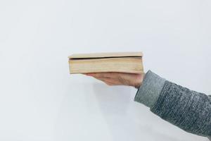 Man holding close old paper book photo