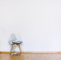 Indoors flat wall mockup with Clothes on Chair photo