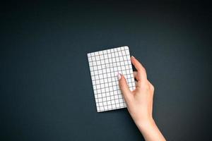 Woman hands with notebook photo