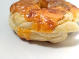 Morning breakfast a delicious bread or burger on a white plate. Good for used on business related to food, pastry, bakery, restaurant. photo