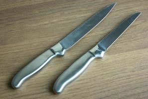 kitchen knife on dark wood background photo