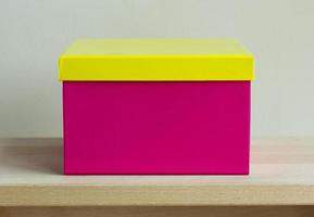blank colorful paper box on wooden table photo