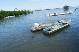 Pangkajene and Kepulauan, South Sulawesi, Indonesia - May 14, 2022, Empty boat is in the middle of the sea photo