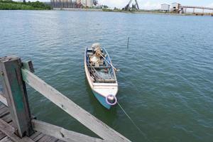 Pangkajene and Kepulauan, South Sulawesi, Indonesia - May 14, 2022, Empty boat is in the middle of the sea photo