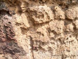 The texture of stone used for background images, Surface of stone brown color photo