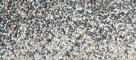 Texture of pebbles in panorama view  for background images photo