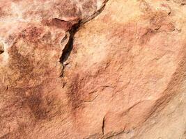 la textura de la piedra utilizada para imágenes de fondo, superficie de color marrón piedra foto