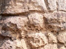 The texture of stone used for background images, Surface of stone brown color photo