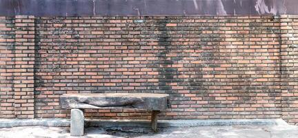 Texture of red brick use for background images, The pattern of bricks with chair made of wood photo