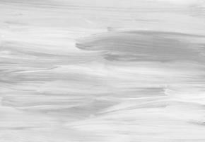 Abstract white background. Light monochrome backdrop. Brush strokes on paper. photo