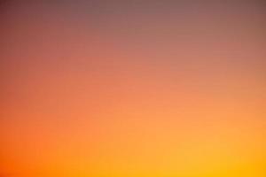 Beautiful gradiant orange clouds and sunlight on the blue sky perfect for the background, take in everning,Twilight, rainy season,winter, summer photo