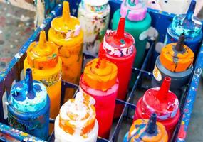 colorful bottles in plastic case photo