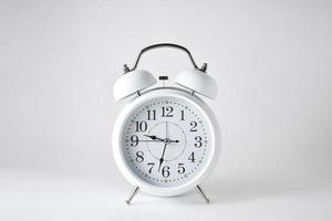 White alarm clock with white background photo