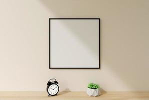 Clean and minimalist front view square black photo or poster frame mockup hanging on the wall with plant. 3d rendering.