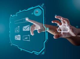 Finger pointing at the hologram screen Represents search, communication, storage with cloud computing. photo