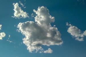 The beautiful shape of clouds on the bright blue sky, sky and clouds background. photo