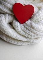 Valentine heart on a white scaf. Background for Valentines day greeting card, concept of romantic celebration.winter photo