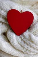 Valentine heart on a white scaf. Background for Valentines day greeting card, concept of romantic celebration photo