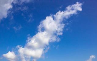 Sunny sky abstract background, beautiful cloudscape, on the heaven, view over white fluffy clouds, freedom concept. photo