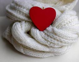 Valentine heart on a white scaf. Background for Valentines day greeting card, concept of romantic celebration photo