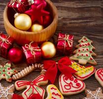 Knar and christmas food sweet cookies on wooden table background. Copy space. Selective focus. Happy new year concept. photo