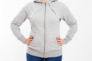 Girl in a gray sweatshirt with a hood and an empty space for a logo isolated close up photo